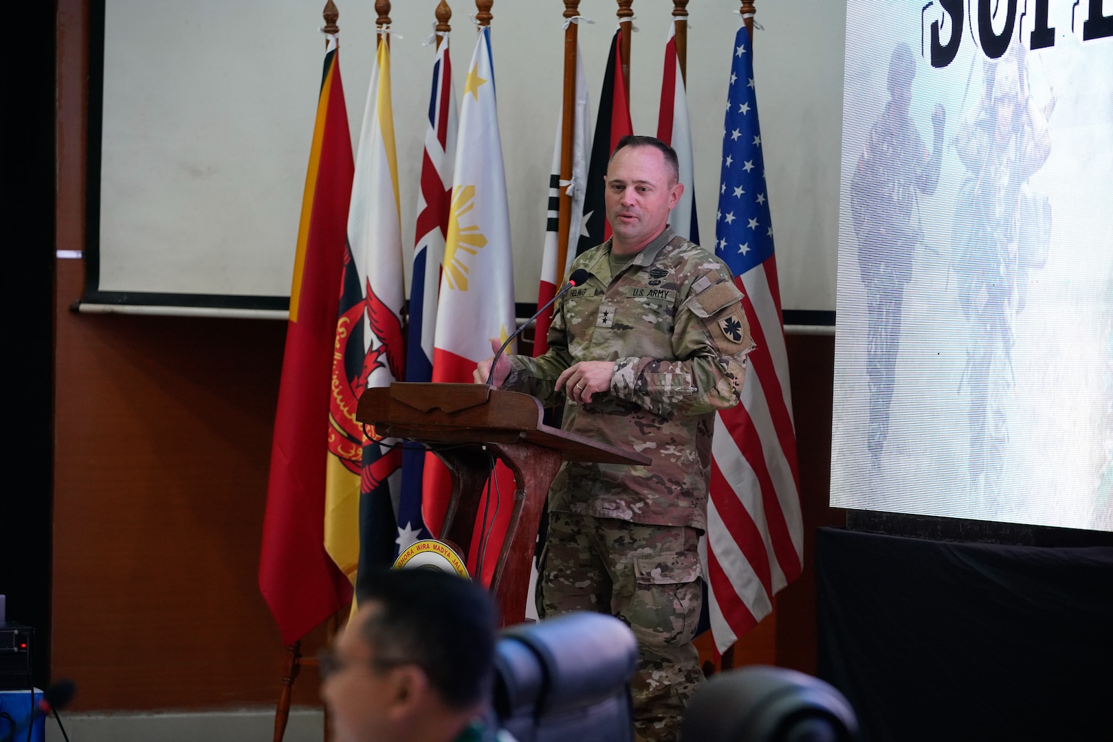 Maj. Gen. Jered P. Helwig, Commanding General, 8th Theater Sustainment Command, offers his opening remarks during the opening ceremony of staff exercise portion of Super Garuda Shield 2023 (SGS23) August 31, 2023, Surabaya Indonesia. #SuperGarudaShield 2023 is an annual exercise that has significantly grown in scope and size since 2009. #SGS2023 is the second consecutive time this exercise has grown into a combined and #joint event, highlighting the 6 participating and 12 observing nations’ commitment to #partnership and a #freeandopenindopacific. (US Air National Guard Photo by Air Force Master Sgt. Andrew Lee Jackson)