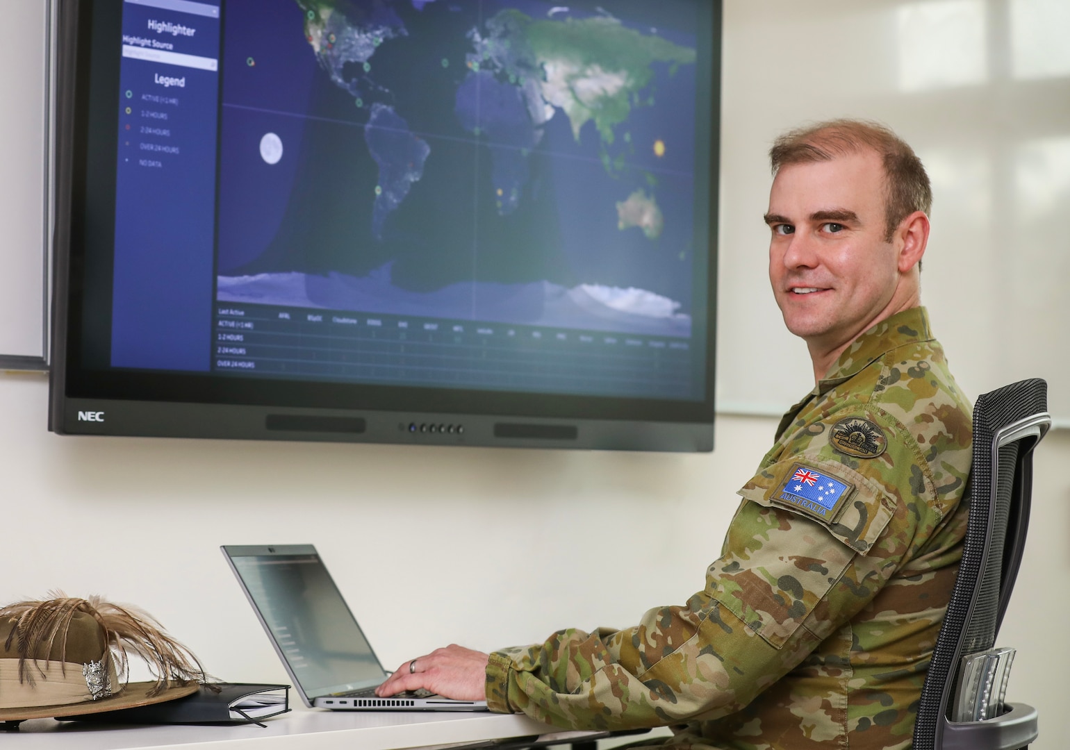 man sitting at a computer screen