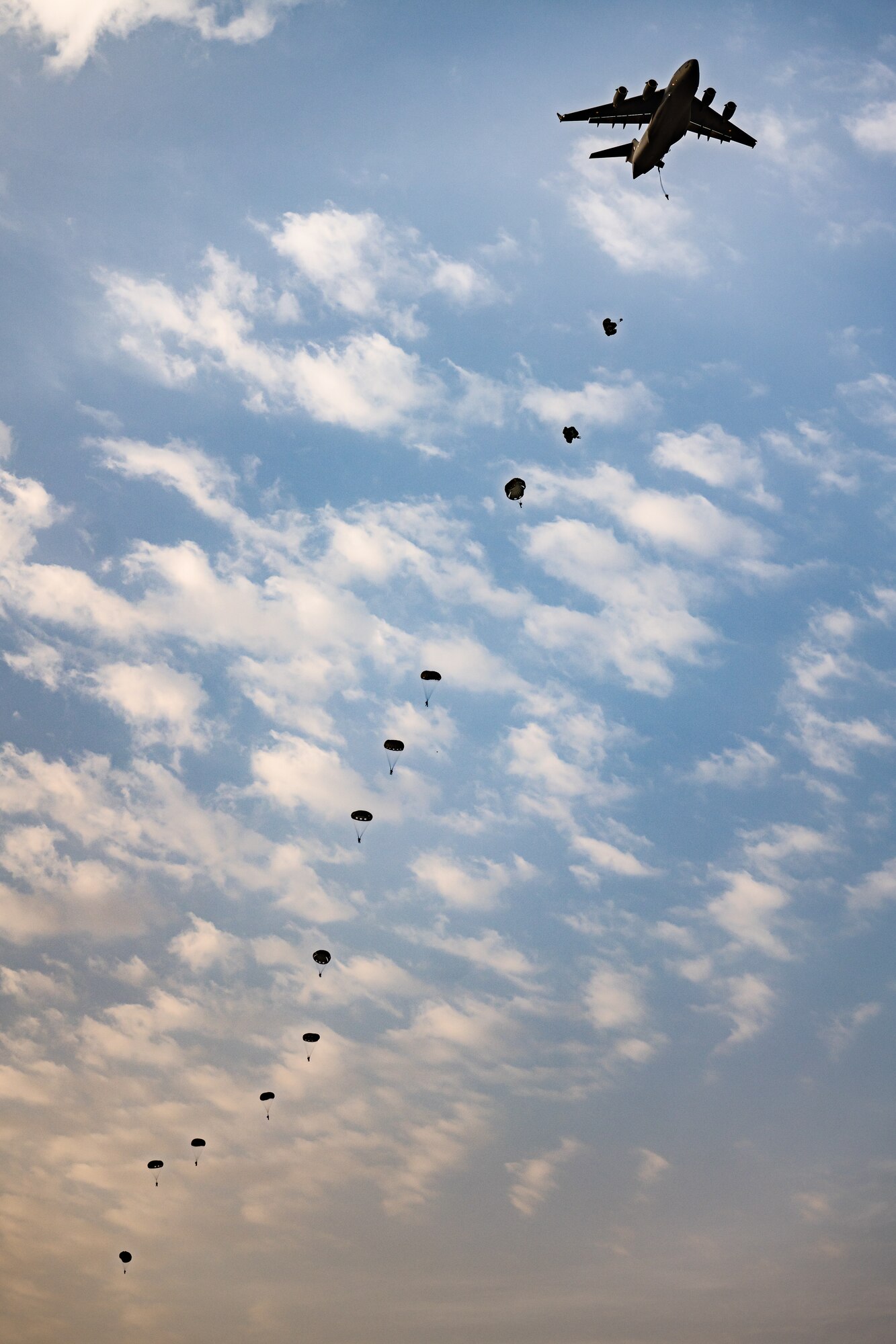 Paratroopers jumping from an aircraft