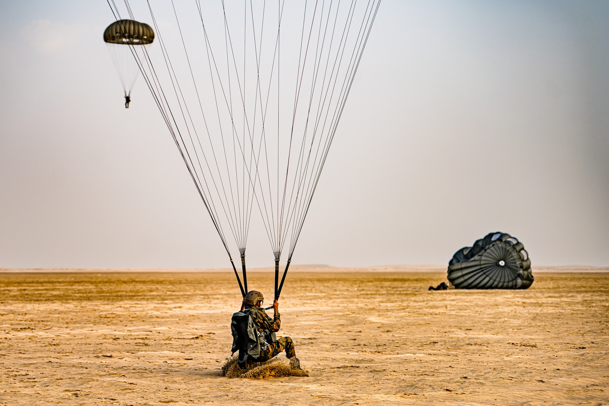 Paratrooper landing in the sand