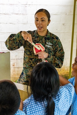 U.S. Navy Hospital Corpsman 2nd Class Leianna Adame, a native of Orange County, California and a dental technician with Task Force Koa Moana 23, shows kindergarteners how to properly brush their teeth at Koror Elementary School in Koror, Palau, Aug. 24, 2023. Task Force Koa Moana 23, composed of U.S. Marines and Sailors from I Marine Expeditionary Force, deployed to the Indo-Pacific to strengthen relationships with Pacific Island partners through bilateral and multilateral security cooperation and community engagements. (U.S. Marine Corps photo by Staff Sgt. Courtney G. White)