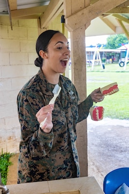 U.S. Navy Hospital Corpsman 2nd Class Leianna Adame, a native of Orange County, California and a dental technician with Task Force Koa Moana 23, shows kindergarteners how to properly brush their teeth at Koror Elementary School in Koror, Palau, Aug. 24, 2023. Task Force Koa Moana 23, composed of U.S. Marines and Sailors from I Marine Expeditionary Force, deployed to the Indo-Pacific to strengthen relationships with Pacific Island partners through bilateral and multilateral security cooperation and community engagements. (U.S. Marine Corps photo by Staff Sgt. Courtney G. White)