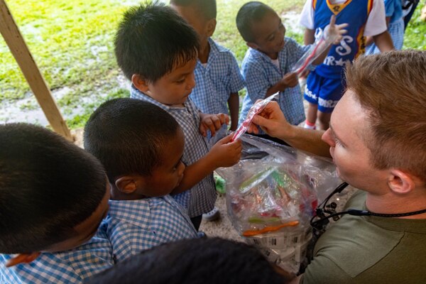 U.S. Navy Lt. Cody Kramer, a native of Lake Havasu City, Arizona and a general dentist with Task Force Koa Moana 23, passes out toothbrushes to kindergarteners at Koror Elementary School in Koror, Palau, Aug. 24, 2023. Task Force Koa Moana 23, composed of U.S. Marines and Sailors from I Marine Expeditionary Force, deployed to the Indo-Pacific to strengthen relationships with Pacific Island partners through bilateral and multilateral security cooperation and community engagements. (U.S. Marine Corps photo by Staff Sgt. Courtney G. White)