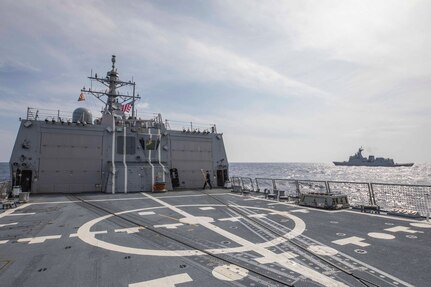230904-N-NF288-005 SOUTH CHINA SEA (Sep. 04, 2023) The Arleigh Burke-class guided-missile destroyer USS Ralph Johnson (DDG 114) sails alongside the Republic of the Philippines Navy ship BRP Jose Rizal (FF 150) during a bilateral sail in the South China Sea, Sep. 4. Ralph Johnson is assigned to Commander, Task Force 71/Destroyer Squadron (DESRON) 15, the Navy’s largest forward-deployed DESRON and the U.S. 7th Fleet’s principal surface force. (U.S. Navy photo by Mass Communication Specialist 1st Class Jamaal Liddell)