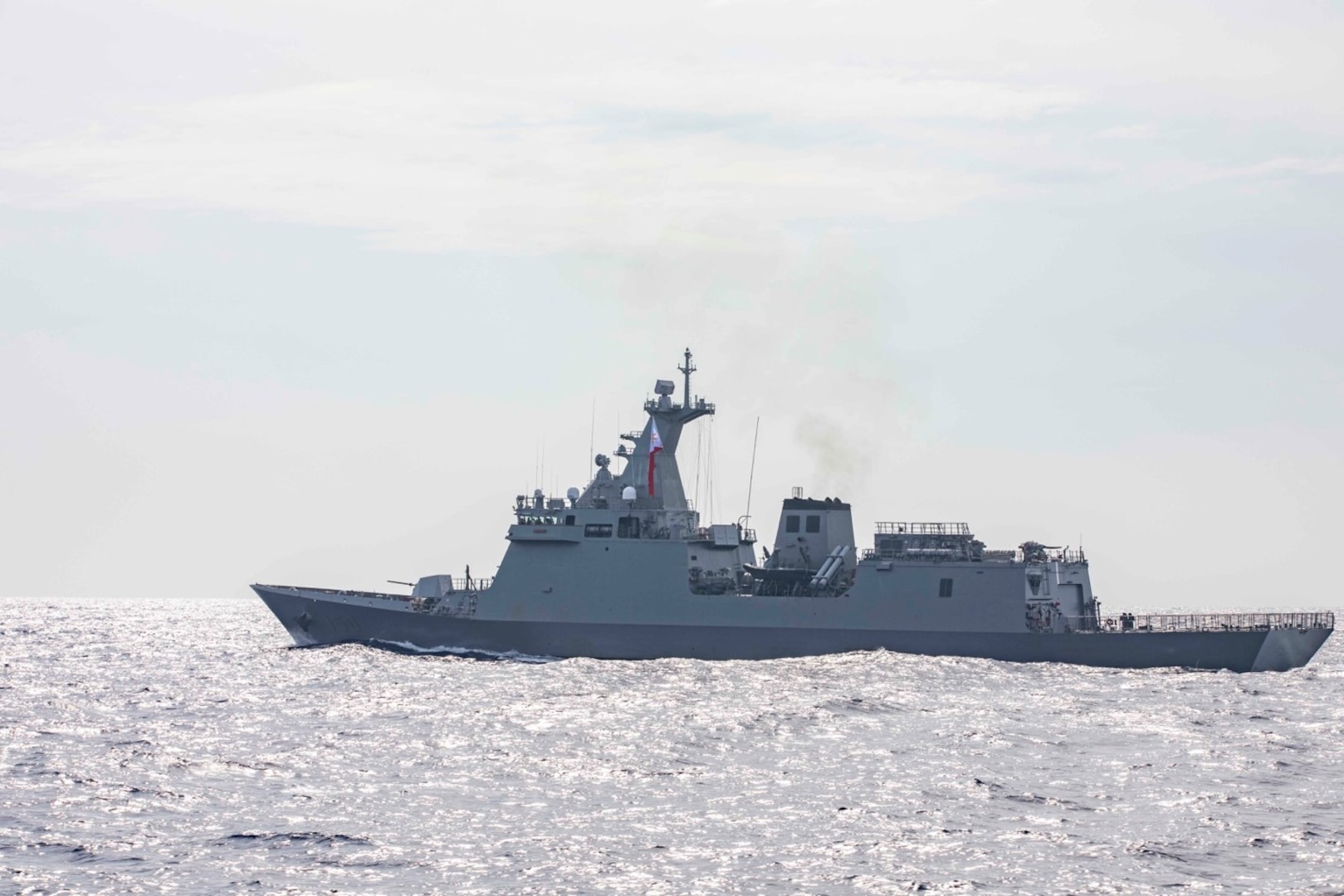 230904-N-NF288-008 SOUTH CHINA SEA (Sep. 04, 2023) The Arleigh Burke-class guided-missile destroyer USS Ralph Johnson (DDG 114) sails alongside the Republic of the Philippines Navy ship BRP Jose Rizal (FF 150) during a bilateral sail in the South China Sea, Sep. 4. Ralph Johnson is assigned to Commander, Task Force 71/Destroyer Squadron (DESRON) 15, the Navy’s largest forward-deployed DESRON and the U.S. 7th Fleet’s principal surface force. (U.S. Navy photo by Mass Communication Specialist 1st Class Jamaal Liddell)