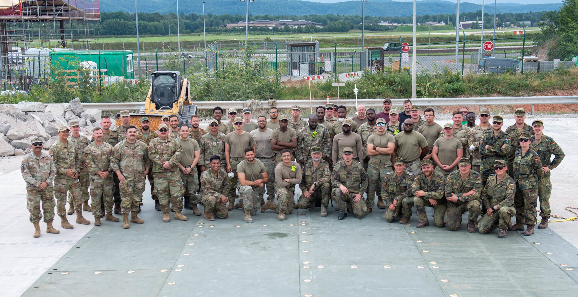 German air force members and U.S. Air Force Airmen stand together