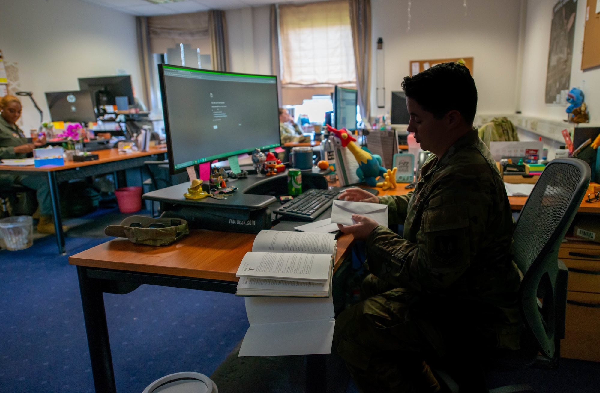Tech. Sgt. Savanna Hudnall works at her desk