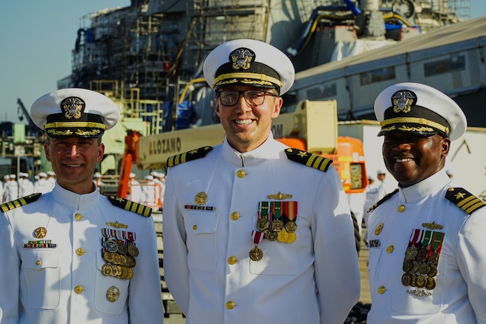 NAVAL STATION ROTA, Spain (August 24, 2023) Capt. Ed Sundberg, Commodore, Destroyer Squadron (DESRON) 60, presides over a change of command ceremony where Cmdr. Tyrchra Bowman (right) relieves Cmdr. Peter Flynn (left) as commanding officer of USS Arleigh Burke (DDG 51), homeported at Naval Station (NAVSTA) Rota, Spain August 24, 2023. As the "Gateway to the Mediterranean,” NAVSTA Rota provides U.S, NATO and allied forces a strategic hub for operations in Europe, Africa and the Middle East. NAVSTA Rota is a force multiplier capable of promptly deploying and supporting combat-ready forces through land, air and sea, enabling warfighters and their families, sustaining the fleet and fostering the U.S. and Spanish partnership. (U.S. Navy photo by LTJG Benjamin K. Cusimano)