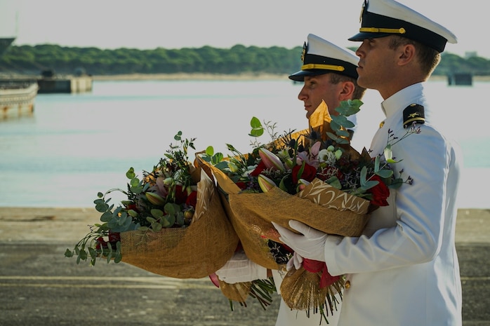 NAVAL STATION ROTA, Spain (August 24, 2023) Capt. Ed Sundberg, Commodore, Destroyer Squadron (DESRON) 60, presides over a change of command ceremony where Cmdr. Tyrchra Bowman (right) relieves Cmdr. Peter Flynn (left) as commanding officer of USS Arleigh Burke (DDG 51), homeported at Naval Station (NAVSTA) Rota, Spain August 24, 2023. As the "Gateway to the Mediterranean,” NAVSTA Rota provides U.S, NATO and allied forces a strategic hub for operations in Europe, Africa and the Middle East. NAVSTA Rota is a force multiplier capable of promptly deploying and supporting combat-ready forces through land, air and sea, enabling warfighters and their families, sustaining the fleet and fostering the U.S. and Spanish partnership. (U.S. Navy photo by LTJG Benjamin K. Cusimano)