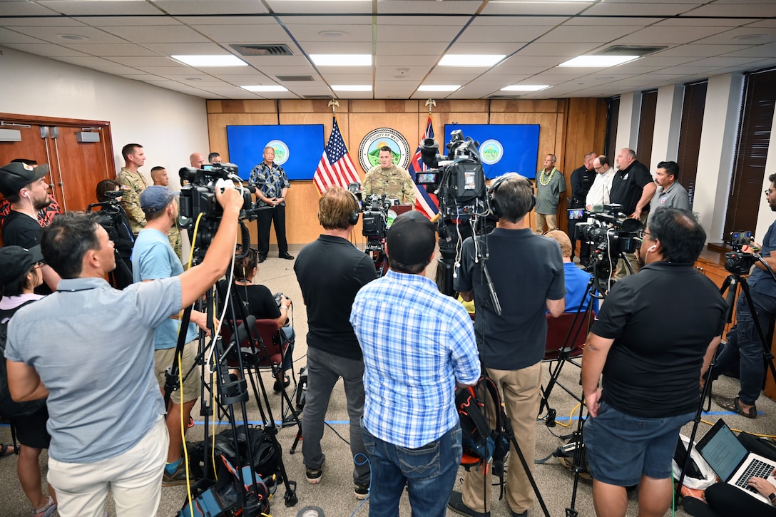 A military officer holds a news conference.