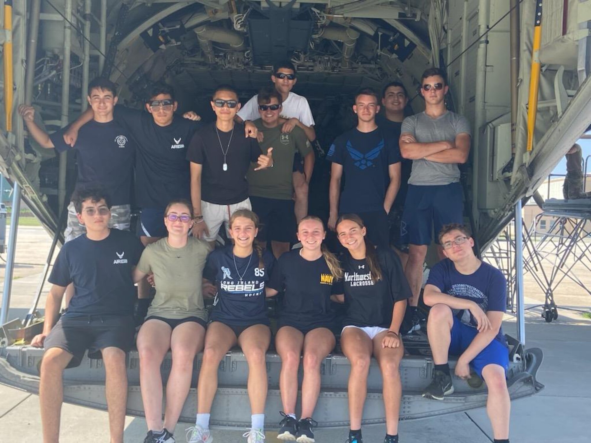 JROTC cadets take a group picture on the HC-130J Combat King II, July 21, 2023 at F.S Gabreski Air National Guard Base, Westhampton Beach, New York. The four-day JROTC camp offered an opportunity for fourteen JROTC cadets to experience a close up-view of military operations. (Courtesy Photo by Air National Guard Maj Martin Viera)