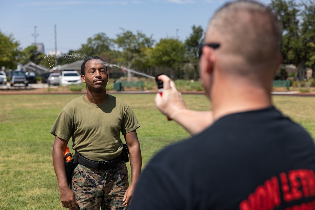 U.S. Marine Corps Sgt. Deandre D. Smith, an administration clerk with Marine Corps Individual Reserve at Marine Forces Reserve, participates during the oleoresin capsicum maneuver course during Security Augmentation Force training on Marine Forces Support Facility New Orleans, Louisiana, Aug 31, 2023. SAF training is done to provide the Marine Corps with qualified and properly trained Marines to support Military Provost Marshal’s Office. (U.S. Marine Corps photo by Sgt. Emely Gonzalez)
