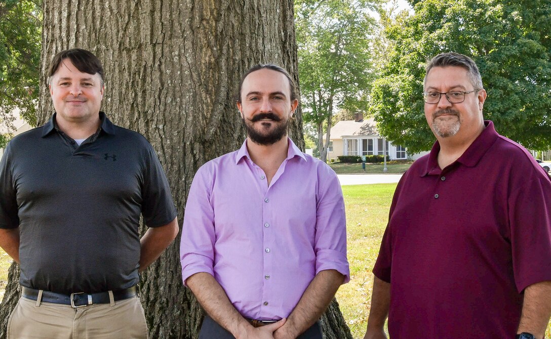 IMAGE: Timothy Van Drew, Xavier Sidney and Robert Quinnan (left to right) of the Integrated Combat Systems Department at Naval Surface Warfare Center Dahlgren Division were members of the Marine Air Defense Integrated System Desktop Trainer Team that earned the 2023 NAVSEA Warfare Centers Innovation Award.