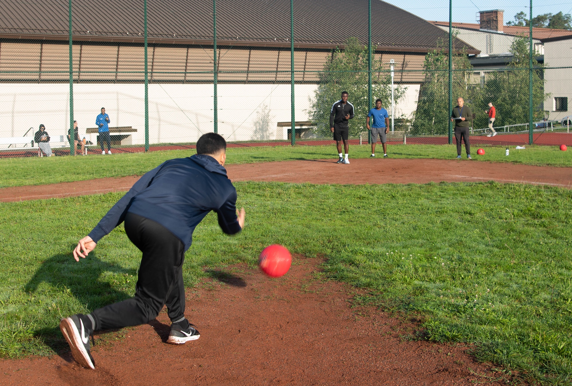 Participants play kickball.