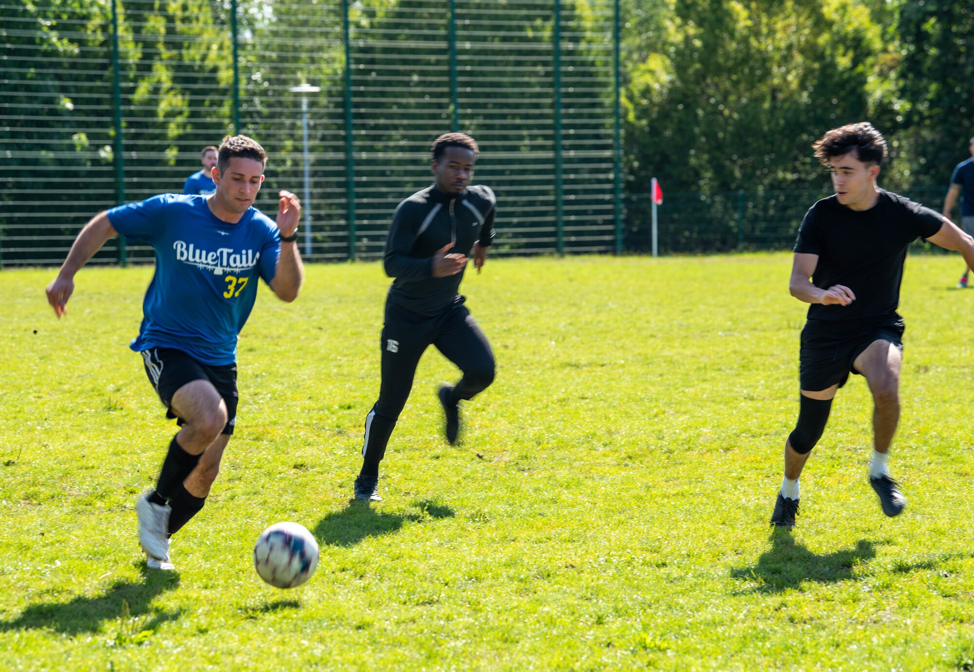 Participants play soccer.
