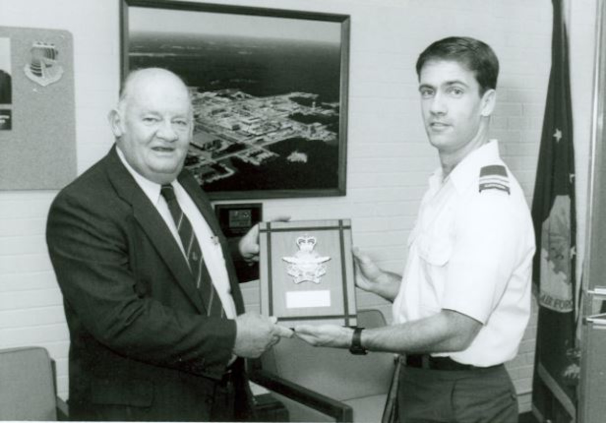 Richard Austin, left, then-director of Propulsion Test at Arnold Engineering Development Center, later known as Arnold Engineering Development Complex, is honored in 1993 as the “founding father” of the Master Data Exchange Agreement between the U.S. and Canada. Austin was honored by the National Research Council of Canada for an agreement he spearheaded which allowed propulsion testing and measurement techniques associated with all types of airbreathing engines to be exchanged between the two governments in an effort to enhance global communication and technical knowledge. Capt. Dan Magee, then-resident Canadian exchange officer at AEDC, is pictured presenting Austin with his plaque. (U.S. Air Force photo)