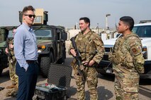 Airman 1st Class Kenny Caniz Lopez and Staff Sgt. Jacob Cecerre, 91st Missile Wing security forces, discuss with a staff member of The United States Senate Committee on Armed Services their job at a demonstration of security forces equipment at Missile Alert Facility Oscar-1 tour at Minot, North Dakota, Aug. 30, 2023. Security Forces job is to deny unauthorized access to Missile Alert Facilities and launch facilities, and to defend the nation’s nuclear assets. (U.S. Air Force Photo by Airman 1st Class Alexander Nottingham)
