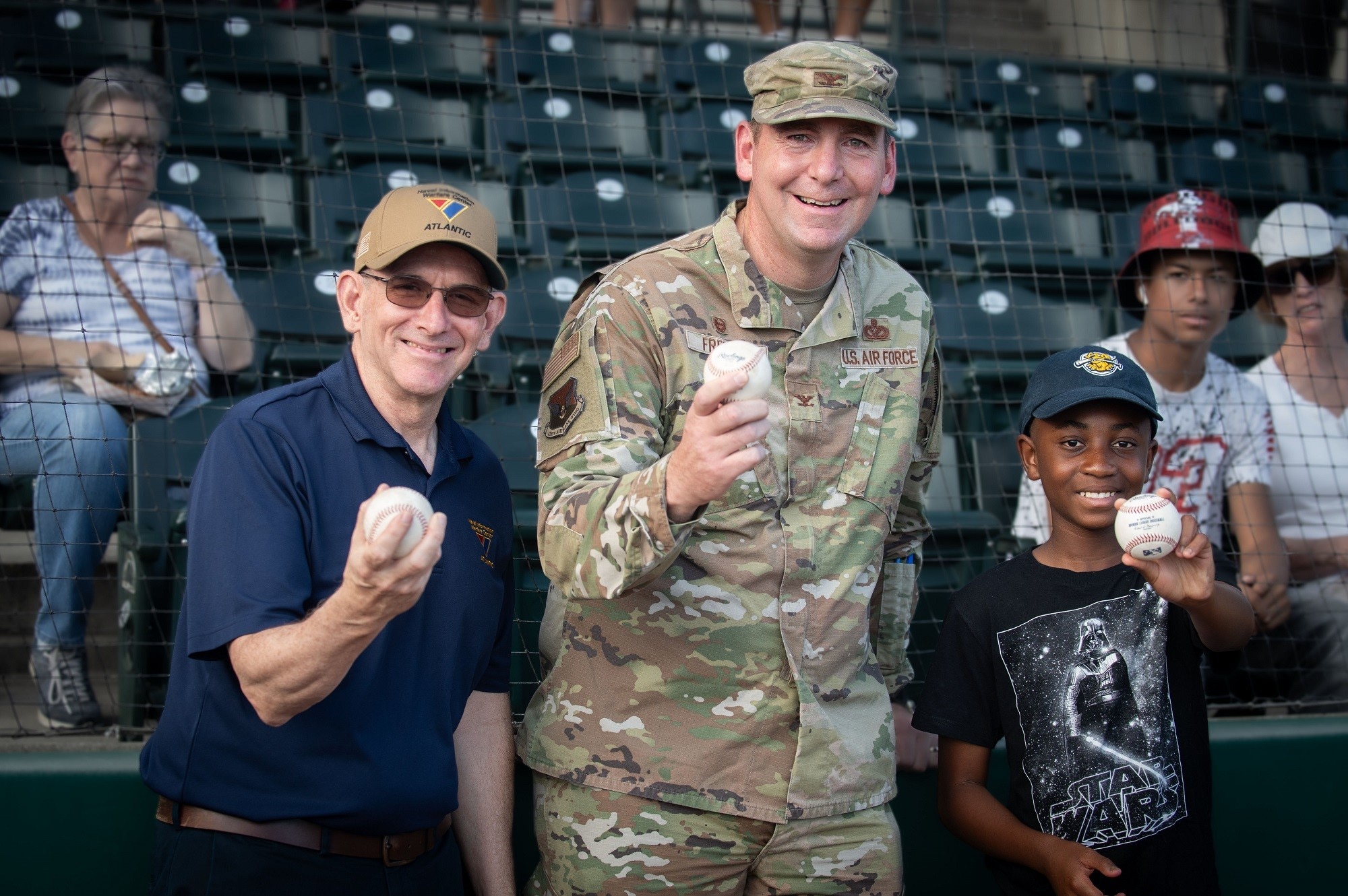 Charleston, SC (September 2, 2023) Naval Information Warfare Center (NIWC) Atlantic Executive Director Peter Reddy and Commander 628th Air Base Wing Joint Base Charleston Colonel Michael Freeman attended the Charleston RiverDogs baseball game to throw out a ceremonial first pitch at the military appreciation game Sept. 2 in Charleston, South Carolina.