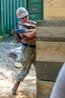CAMP SHELBY, Miss. (Aug. 12, 2023) - Builder 1st Class Melissa Desalvo, assigned to Naval Mobile Construction Battalion (NMCB) 11, uses a sledgehammer to adjust a reinforced bunker wall during "Operation Turning Point", a field training exercise (FTX) on Camp Shelby, Miss., August 12, 2023. Operation Turning Point is a field exercise conducted by Naval Construction Group (NCG) TWO that places a battalion in a simulated hostile environment in order to test the full range of their expeditionary construction skills. (U.S. Navy photo by Mass Communication Specialist 2nd Class James S. Hong)