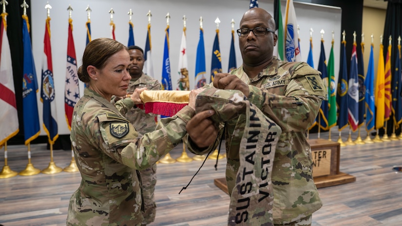 BG Maria Juarez and Sgt. Maj. Ricardo Saunders case the 143rd colors