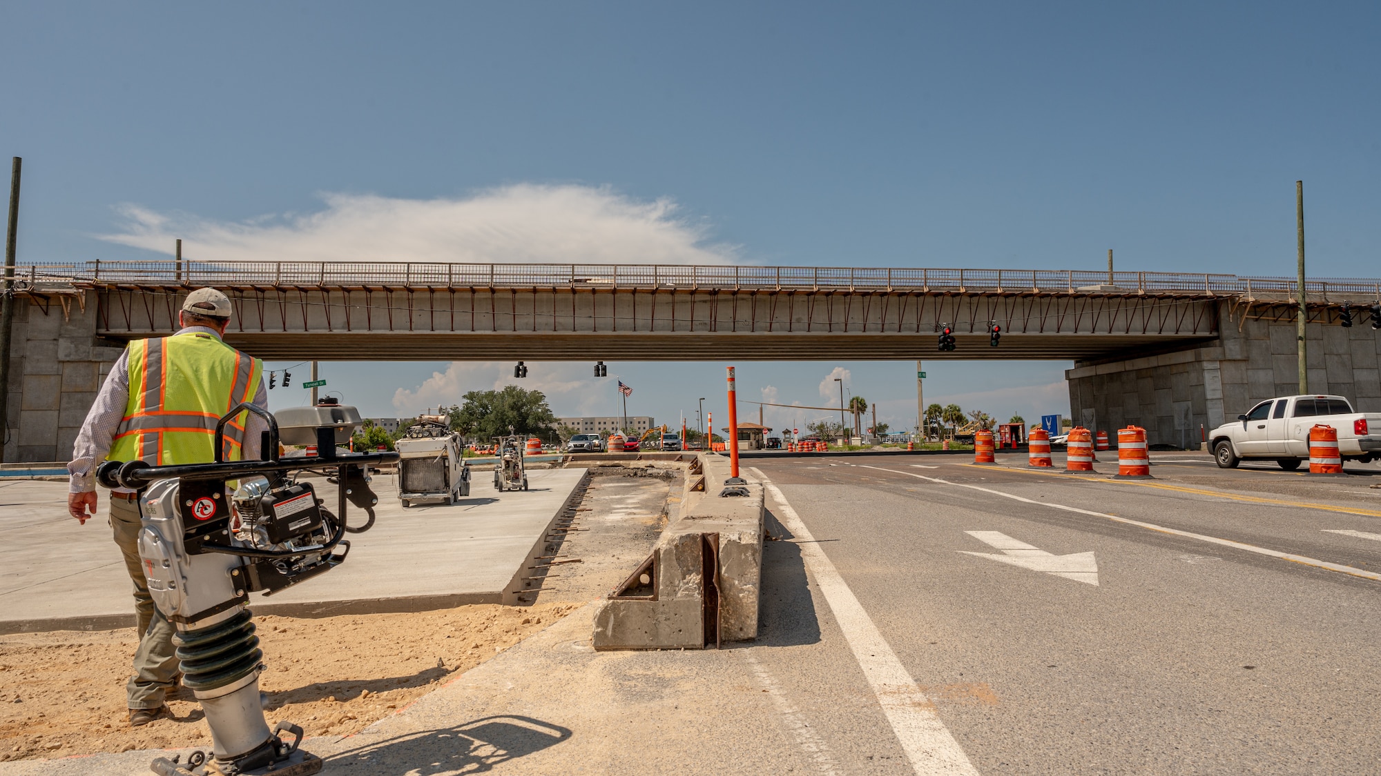 Construction worker surveys a worksite