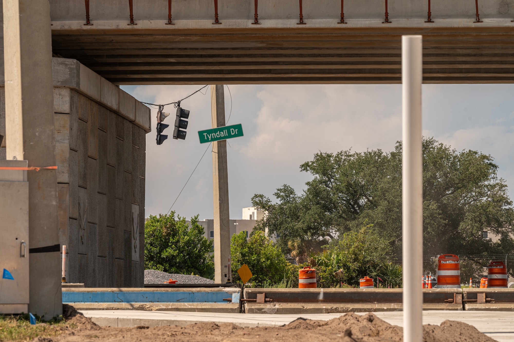 A construction sign sits outside a construction site