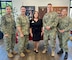 Tracy Owens (center), Programs Manager of Support the Enlisted Project (STEP), a non profit organization dedicated to helping military families in need, poses for a photo with the Naval Base Point Loma Command Triad after STEP was announced as the recipient of the Navy's 2023 Spirit of Hope Award.  The award is presented to individuals or organizations, identified by each service, that embody the core values of Mr. Bob Hope, who gave generously to military men and women for five decades as a comedian and entertainer. Mr. Hope’s values of Duty, Honor, Courage, Loyalty, Commitment, Integrity, and Selfless Dedication exemplify the character traits Service members embody each and every day. (U.S. Navy photo by Sharon StephensonPino/Released)