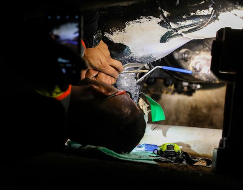 A civilian employee assigned to Joint Task Force Red-Hill performs maintenance on a fuel line during repacking operations inside the Red Hill Bulk Storage Facility, Joint Base Pearl Harbor-Hickam, Hawaii, Aug. 31, 2023. Repacking is necessary to remove all air from the pipelines and ensure a stable flow of fuel when gravity defueling the main underground storage tanks. (DoD photo by U.S. Army Staff Sgt. Randall E. Corpuz)