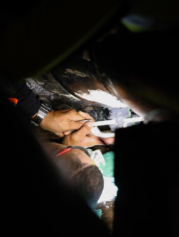 A civilian employee assigned to Joint Task Force Red-Hill performs maintenance on a fuel line during repacking operations inside the Red Hill Bulk Storage Facility, Joint Base Pearl Harbor-Hickam, Hawaii, Aug. 31, 2023. Repacking is necessary to remove all air from the pipelines and ensure a stable flow of fuel when gravity defueling the main underground storage tanks. (DoD photo by U.S. Army Staff Sgt. Randall E. Corpuz)