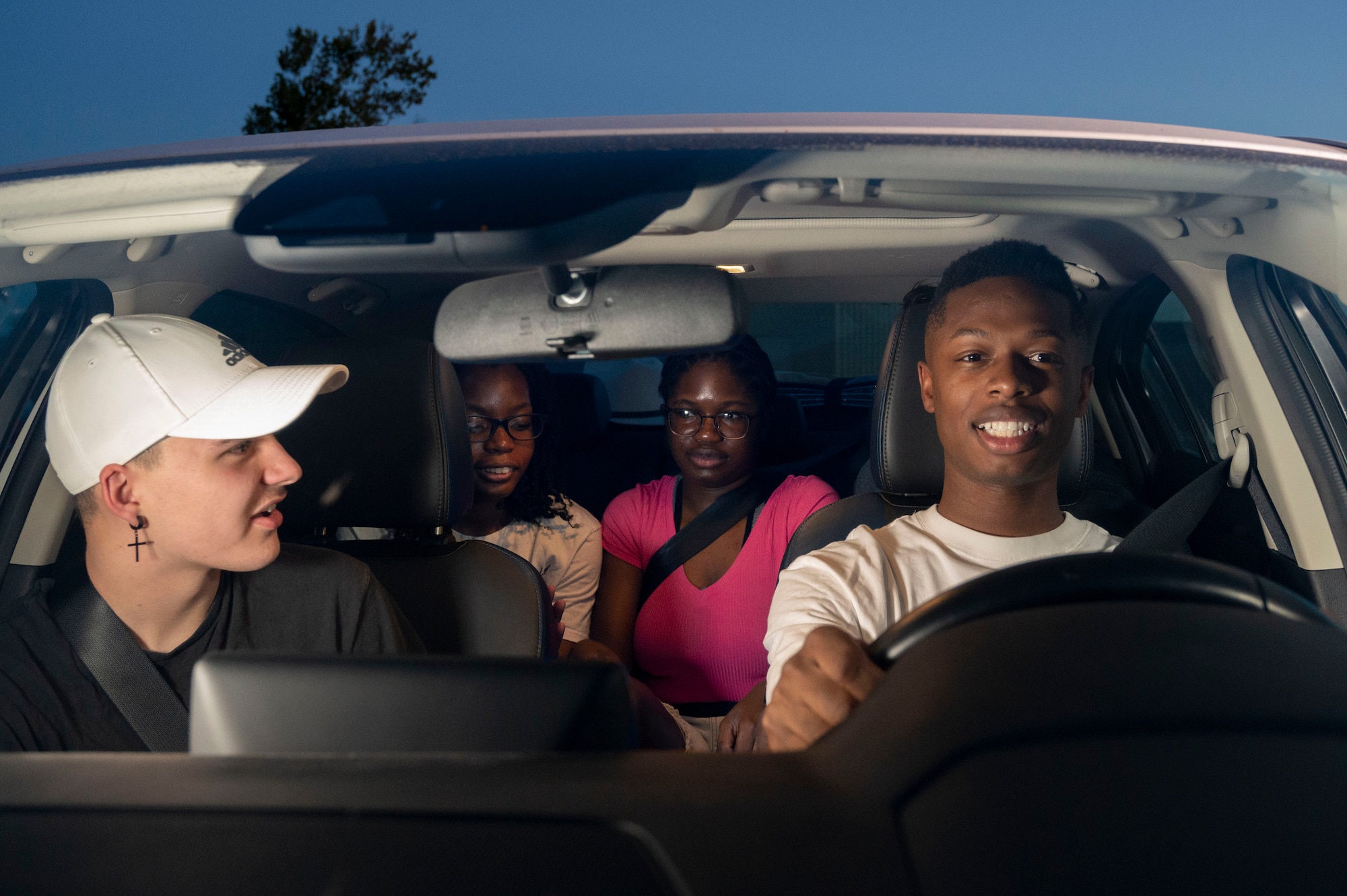 Airman 1st Class Elijah Platts, Base Airmen Against Drunk Driving (B.A.A.D.D.) program volunteer, drives service members home, Aug. 24, 2023. B.A.A.D.D. is a completely anonymous program that offers Airmen of any rank and federal employees the option of having another driver safely take them home when they are under the influence and unfit to do so themselves. (Photo illustration by Airman 1st Class Kailee Reynolds)