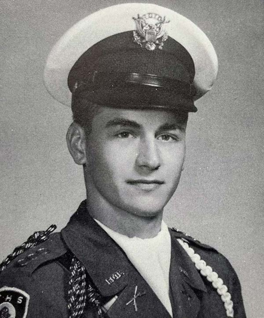 A man in military uniform poses for a photo