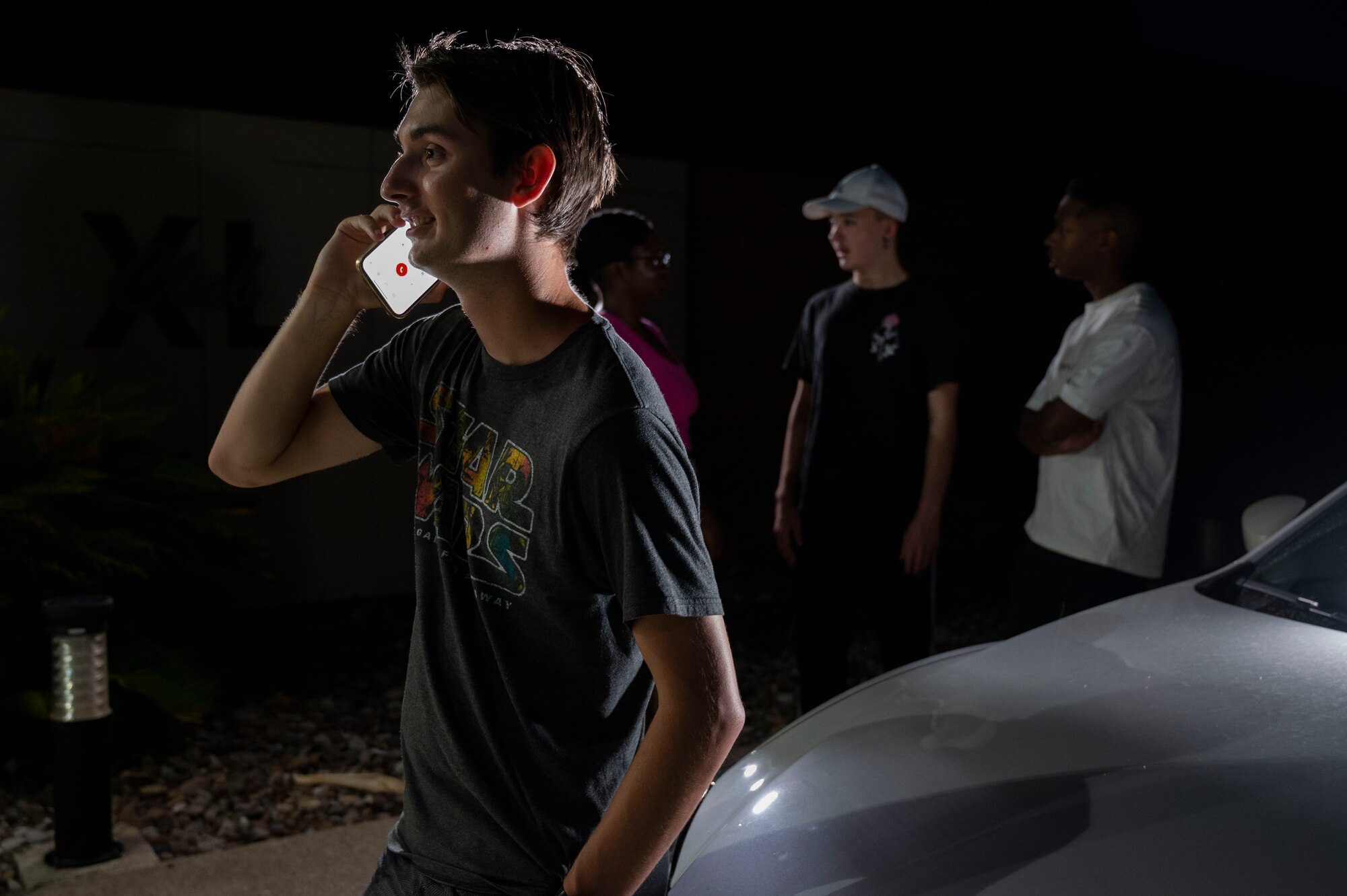 An anonymous Airman calls a Base Airmen Against Drunk Driving (B.A.A.D.D.) program volunteer to request a ride home, Aug. 24, 2023. B.A.A.D.D. is a completely anonymous volunteer-based program designed to offer Airmen of any rank and federal employees the option of a ride home in order to prevent them from driving under the influence . (U.S. Air Force photo illustration by Airman 1st Class Kailee Reynolds)