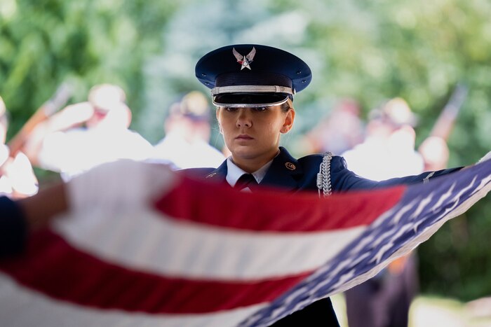 woman holds flag