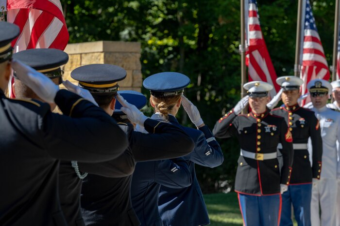 Service members saluting