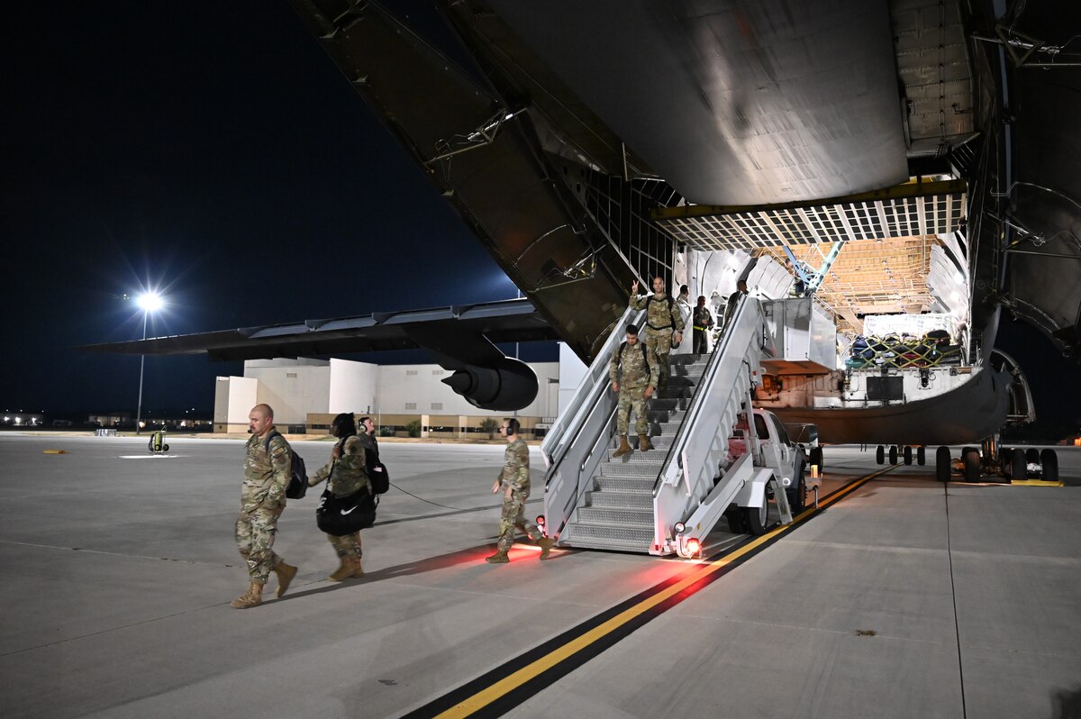 Reserve Citizen Airmen of the 433rd Medical Squadron step off a C-5M Super Galaxy as they return to JBSA-Lackland on Aug. 29, 2023 after participating in Patriot Medic 23.