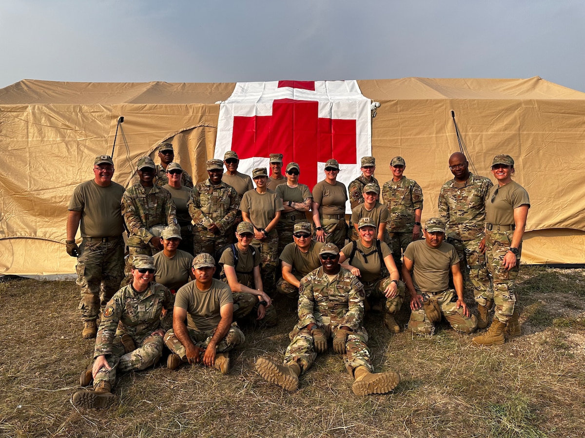 Members of the 433rd Aeromedical Staging Squadron and the 914th Aeromedical Staging Squadron outside their training area at Fort McCoy, Wisconsin during Patriot Medic 23.