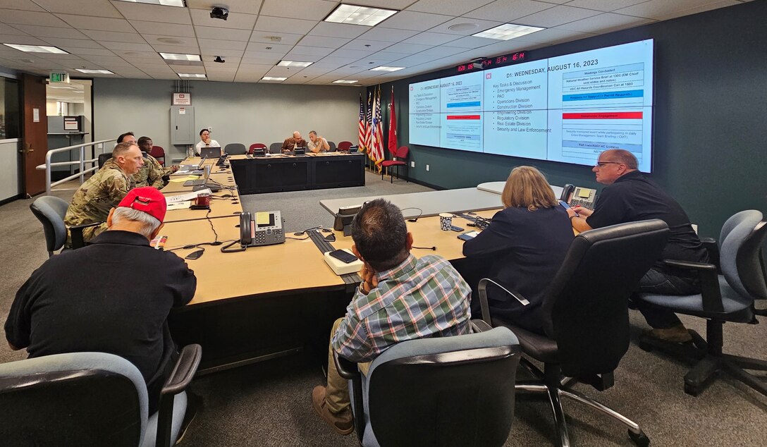 Col. Andrew Baker, center left, listens during an after-action review Aug. 28 about the U.S. Army Corps of Engineers Los Angeles District’s response to Tropical Storm Hilary, starting with day one leading up to the storm, throughout the storm and the two days following the storm.