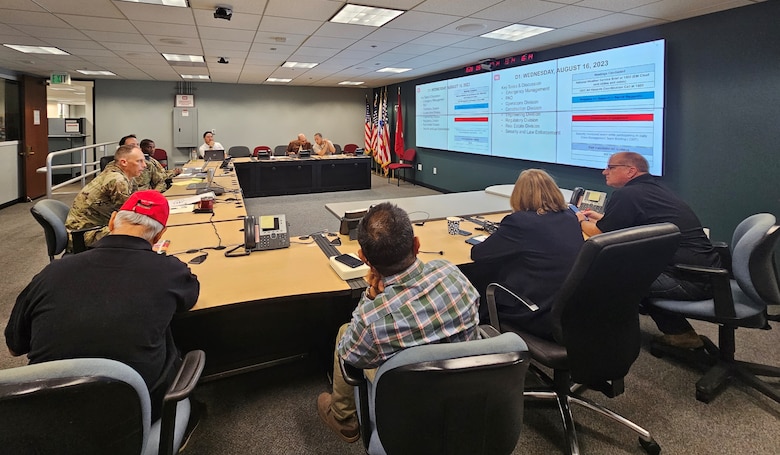 Col. Andrew Baker, center left, listens during an after-action review Aug. 28 about the U.S. Army Corps of Engineers Los Angeles District’s response to Tropical Storm Hilary, starting with day one leading up to the storm, throughout the storm and the two days following the storm.