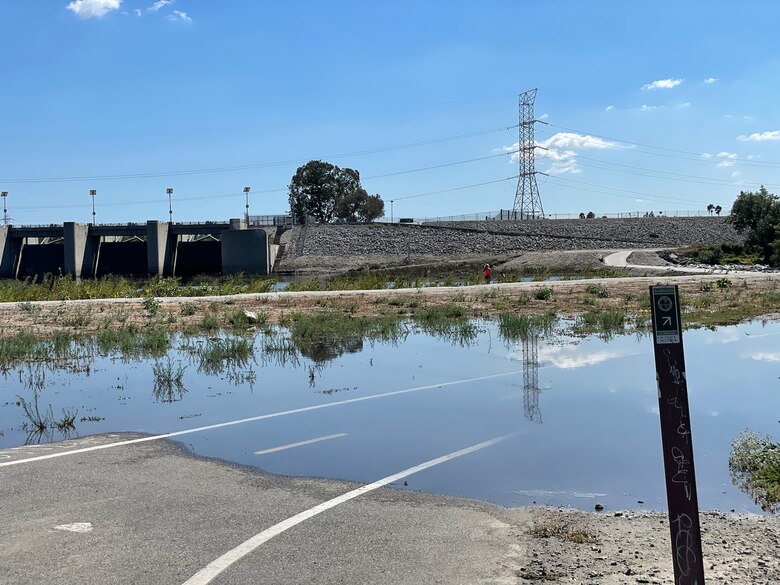Water still covers a bike trail and road Aug. 21 at Whittier Narrows Dam in Pico Rivera, California, the day after Tropical Storm Hilary made landfall. Although the primary purpose of this and other Corps dams is flood-risk management, about 75 percent of stormwater runoff — an estimated 7,000 acre-feet, valued at $7 million — passed through Whittier Narrows Dam and was captured downstream for groundwater recharge by the Los Angeles County Public Works.