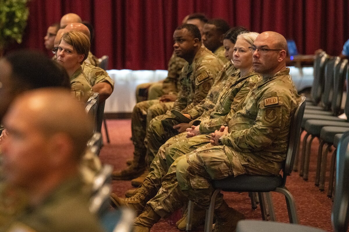 Team Yokota medics assigned to the 374th Medical Group (MDG) stand by to answer community questions during an MHS GENESIS town hall at Yokota Air Base, Japan, Aug. 31, 2023.