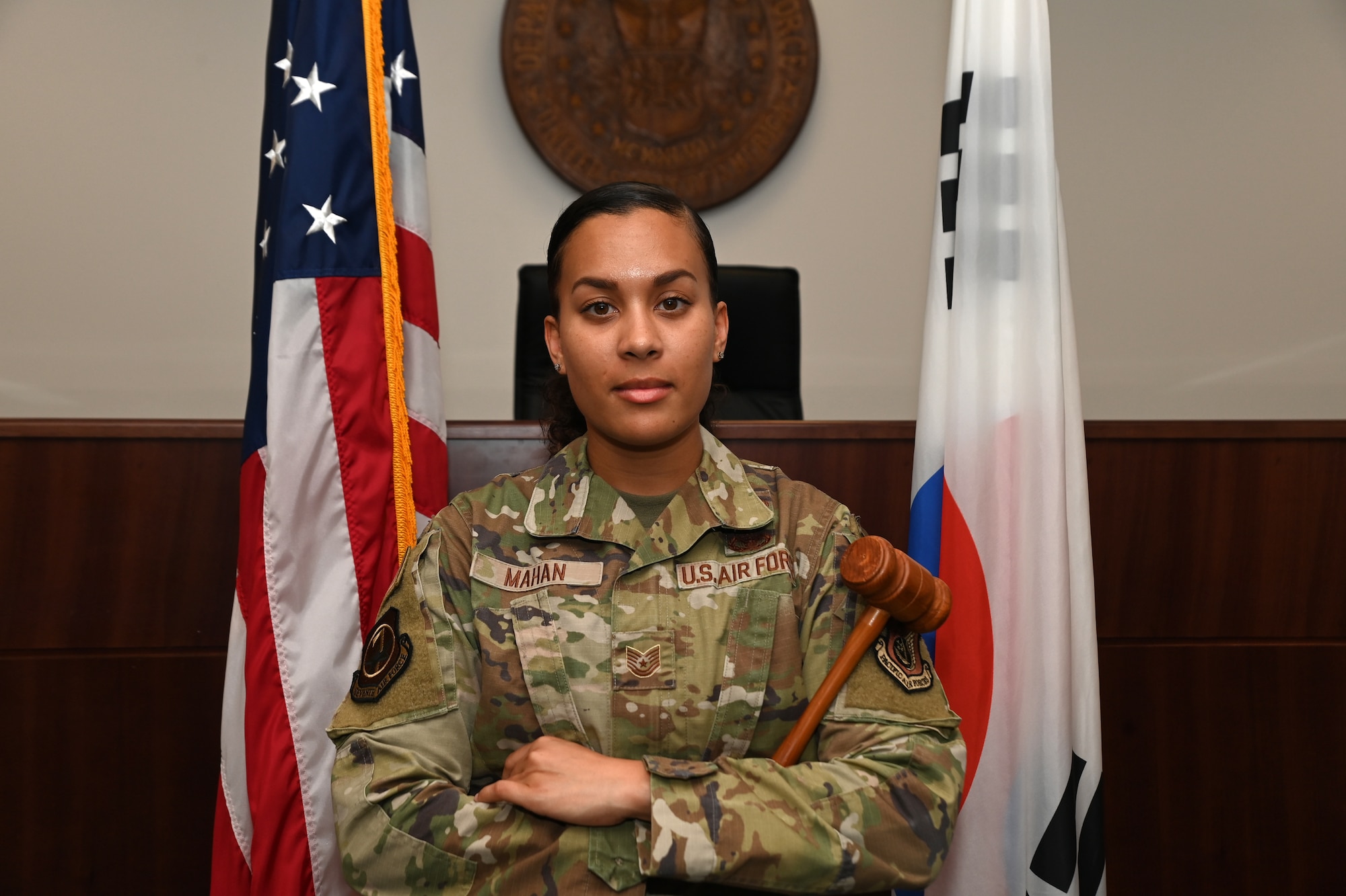 Tech. Sgt. Micaela Mahan, 7th Air Force Office of the Staff Judge Advocate, poses for a photo in a courtroom at Osan Air Base, Republic of Korea, July 20, 2023.