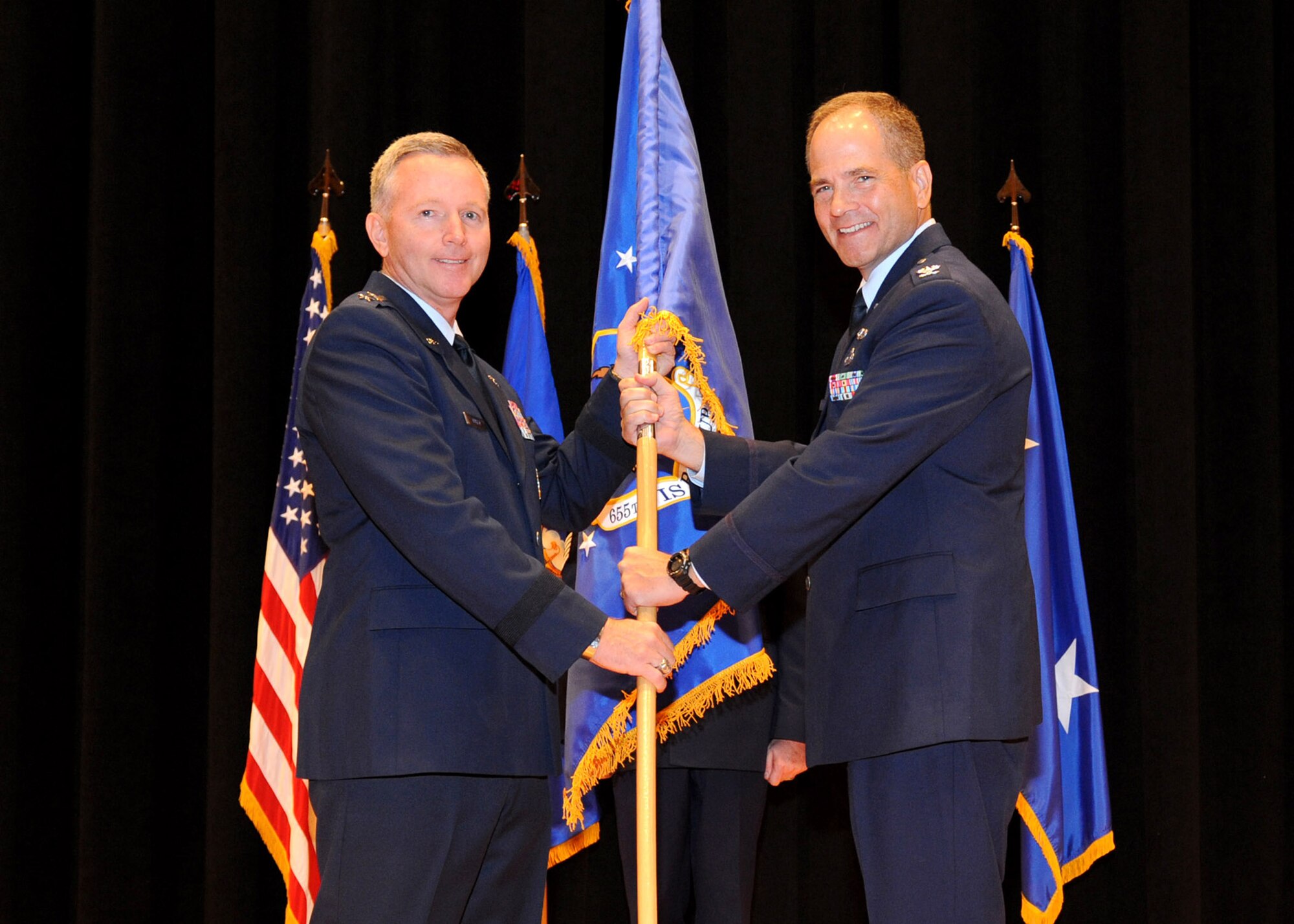 Former 655th Intelligence, Surveillance and Reconnaissance (ISR) Group commander and now retired Col. Douglas Drakeley, right, officially receives command of the newly-stood up ISR unit from then-10th Air Force commander Maj. Gen. William Binger during the group’s official ceremony Sept. 29, 2013, at Wright-Patterson AFB, Dayton, Ohio. (Archive Photo)