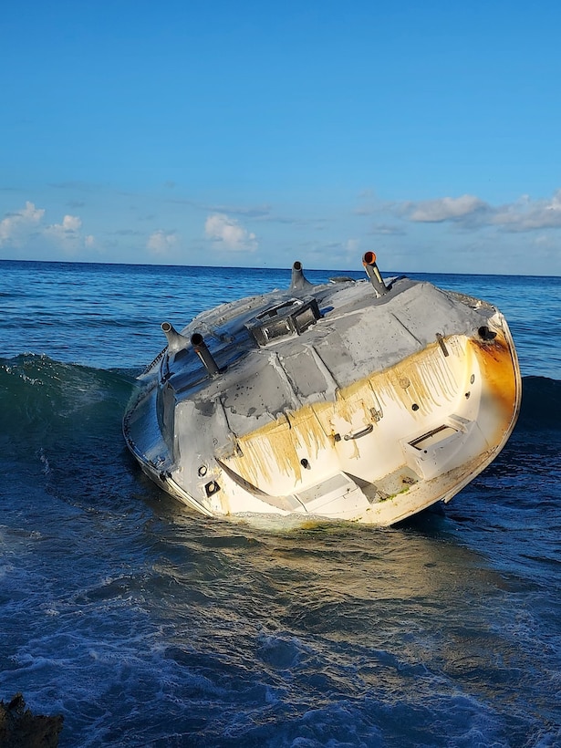 A derelict vessel lays aground on Mona Island, Puerto Rico Sept. 2, 2023, during Coast Guard response efforts to remove the pollution threat impacting the natural reserve.  Resolve Marine cleanup crews, hired as the oil spill response organization for this case, completed the removal of 300 gallons of diesel, oily water waste and two cubic yards of oiled debris from the vessel’s tanks and interior Sept. 5, 2023.  (U.S. Coast Guard photo)