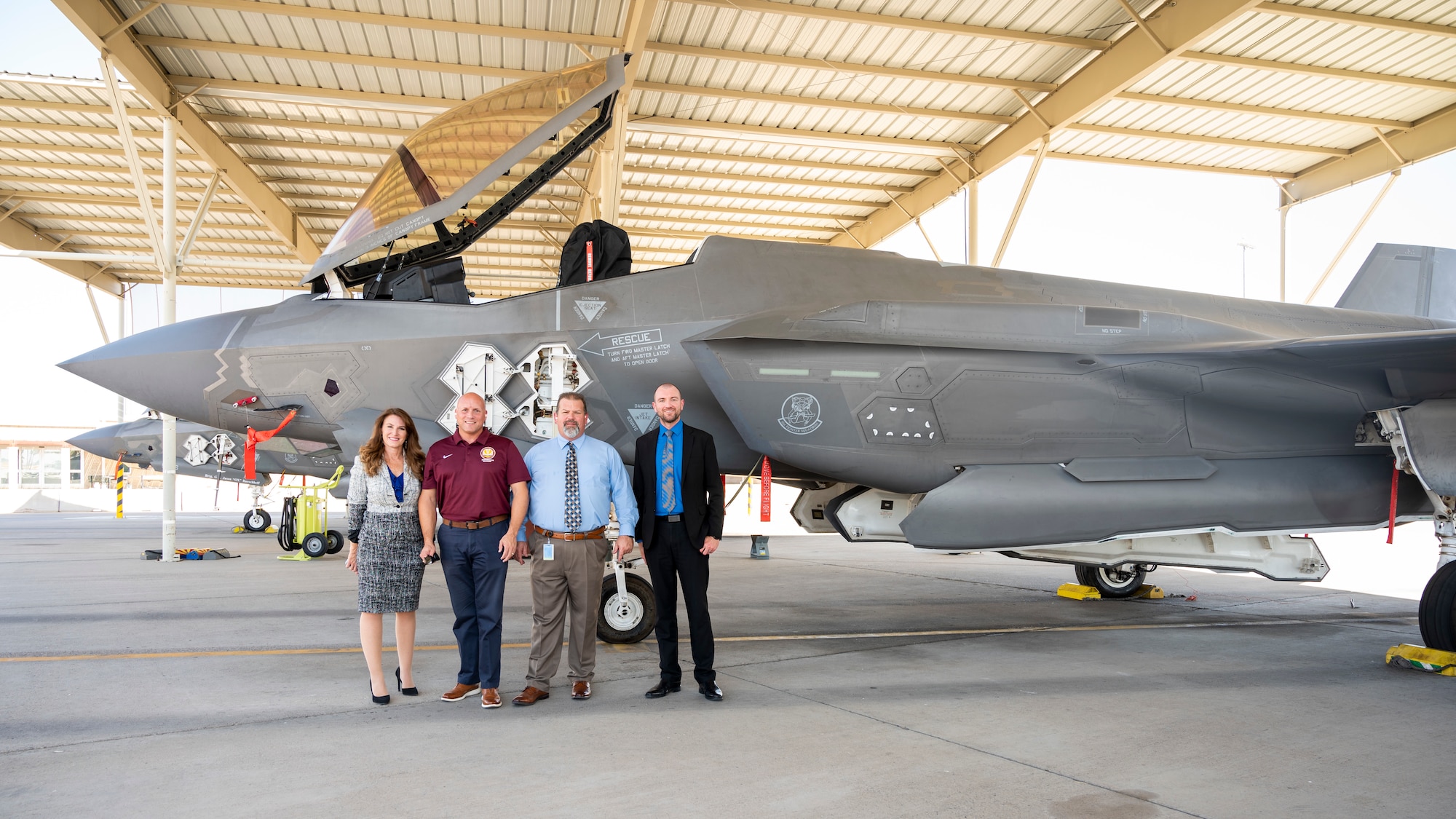 Local school district superintendents pose for a photo in front of an F-35A Lightning II fighter jet during a base visit on August 30, 2023, at Luke Air Force Base, Arizona. During their visit, they discussed resources for schools to respond to the educational and social-emotional challenges military-connected children face during their transition to a new school. (U.S. Air Force photo by Staff Sgt. Collette Brooks)