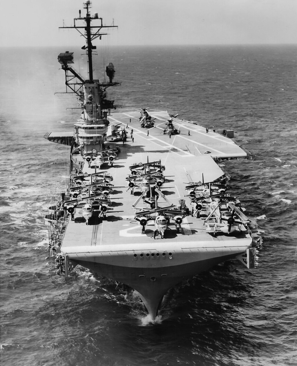 USS Hornet (CVS 12) also went through a series of redesignations (from originally CV 12 to CVA in October 1952, then to CVS in June 1958). Here, the carrier is shown in September 1962 as a CVS with S2F Trackers and SH-3 Sea King helicopters. Her angled flight deck is prominent.