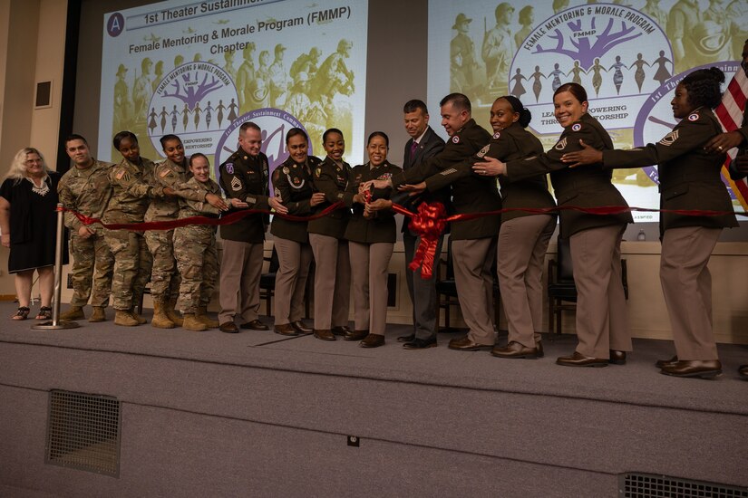 Soldiers and DA civilians of the 1st TSC cut a ribbon at the FMMP launch