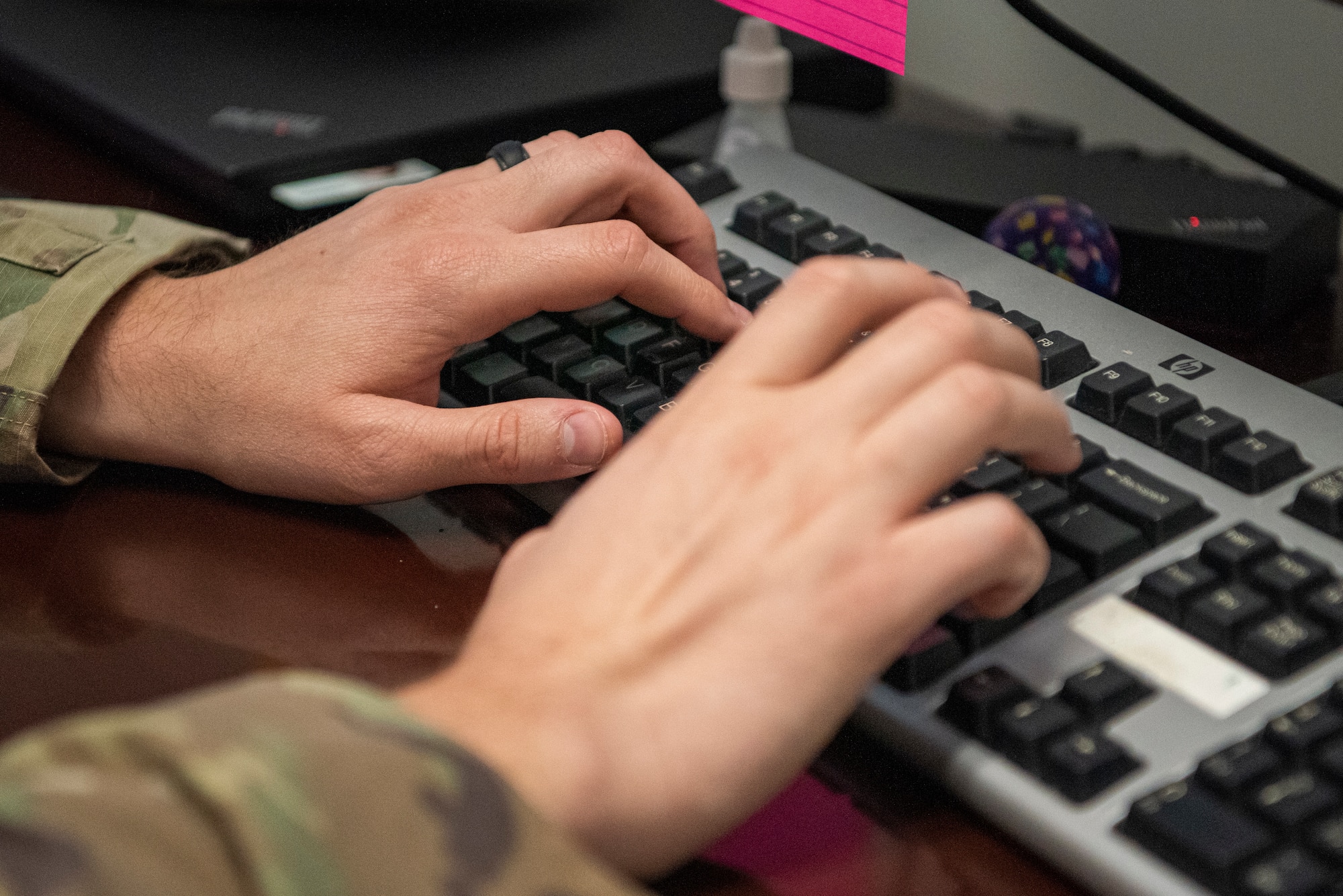 U.S. Air Force Tech. Sgt. Andrew Noble, 81st Training Wing commander’s action group superintendent, types on his computer in the 81st TRW Headquarters building on Keesler Air Force Base, Mississippi, Aug. 15, 2023.