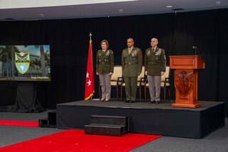 The commander of U.S. Southern Command, Army Gen. Laura Richardson, U.S. Marine Sgt. Maj. Rafael Rodriguez, SOUTHCOM Senior Enlisted Leader, and U.S. Army Command Sgt. Maj. Benjamin Jones stand at attention during a change of responsibility ceremony at the command’s headquarters.