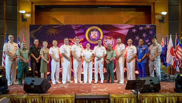 Pacific Partnership 2023 and Malaysian Armed Forces leadership pose for a photo.