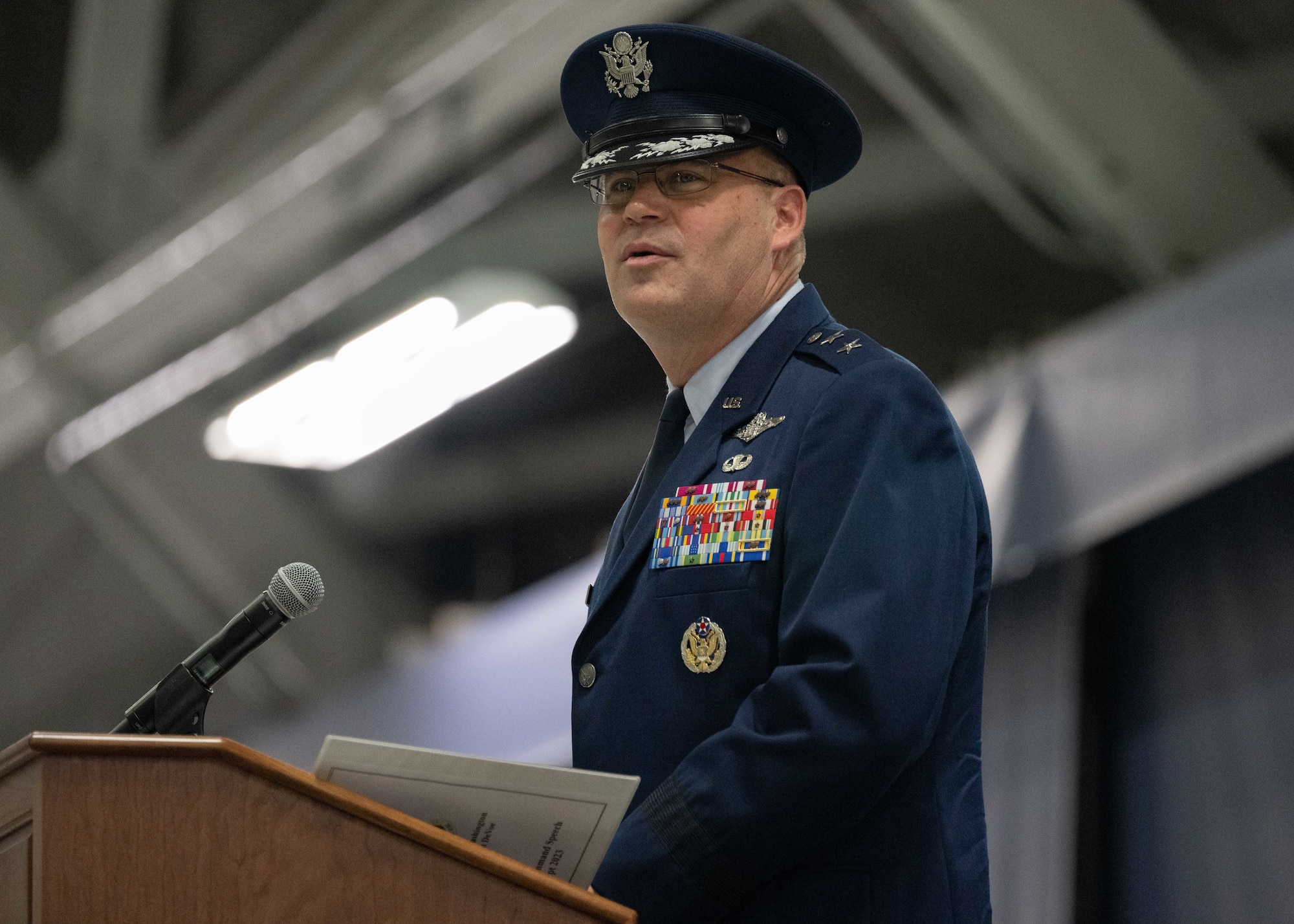 man in uniform speaks at lecturn